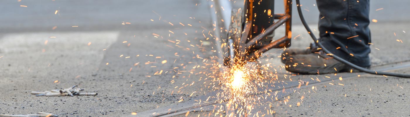 Sparks from a road drill